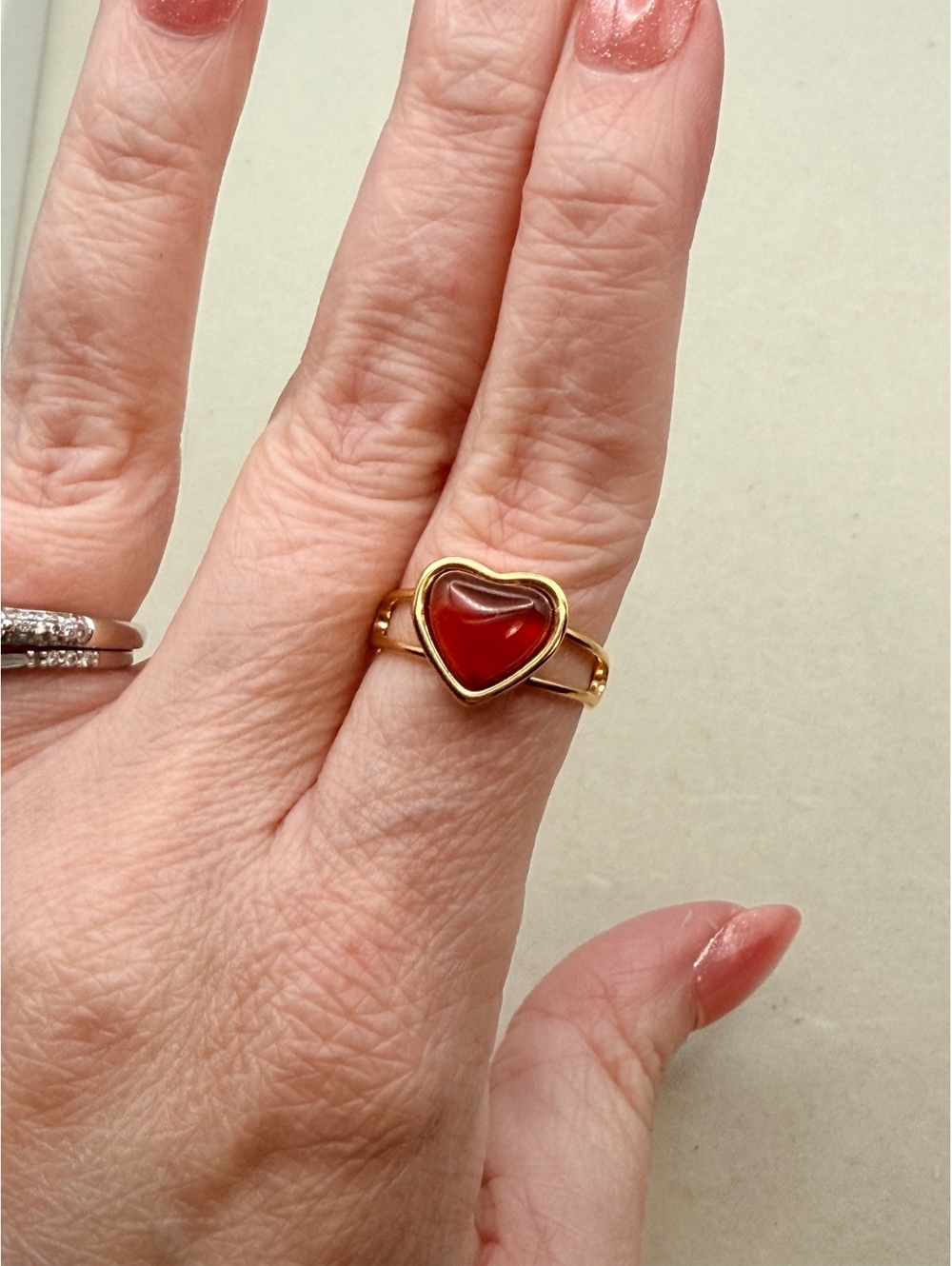 Gold tone red heart ring